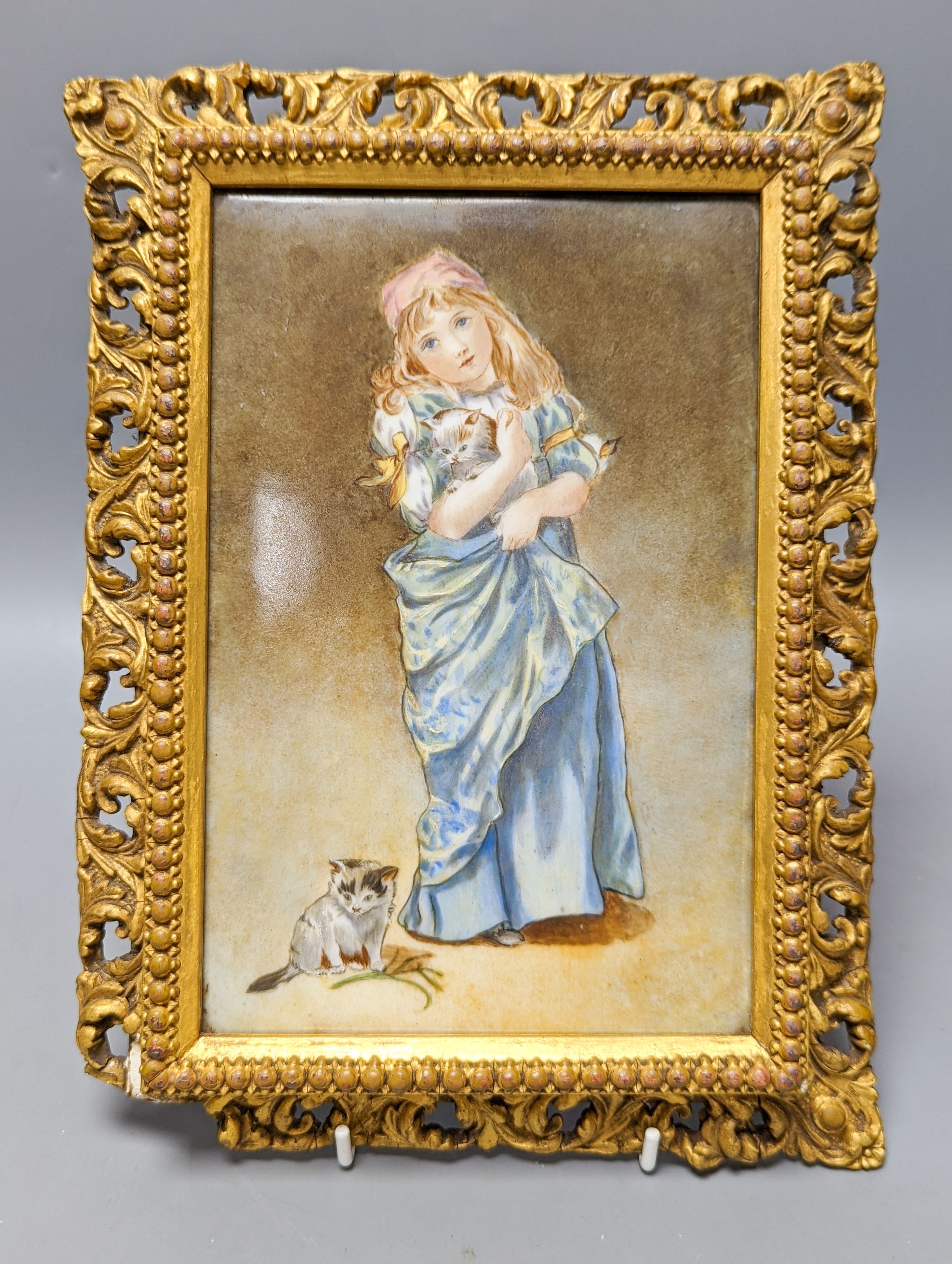 A Victorian porcelain plaque, painted with a girl with kittens, in gilt frame, 28.5 X 21 cm